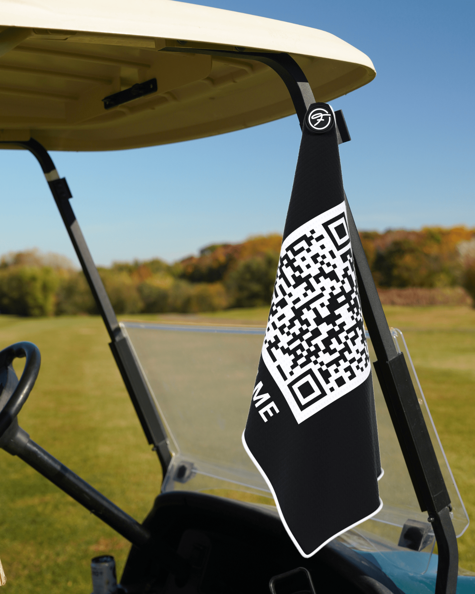 Funny Magnetic Golf Towel with Scan Me design securely attached to a golf cart. #color_scan-me