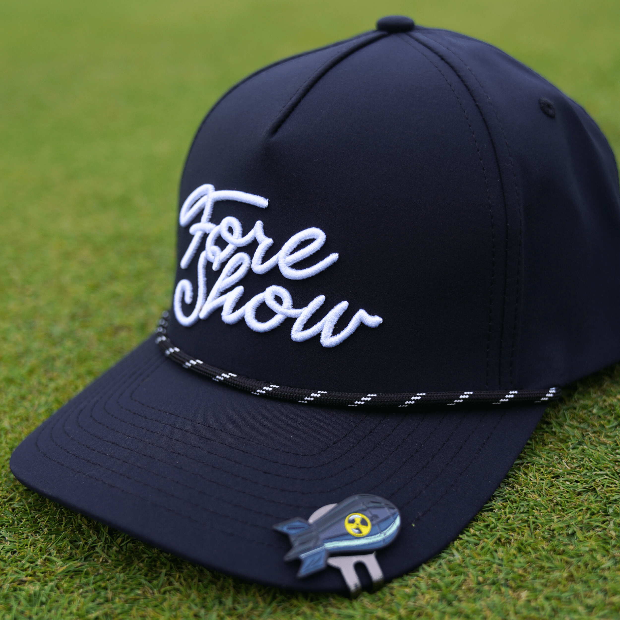 Bombs Away Ball Marker showcasing included hat clip and metallic finish and durable cast metal design.