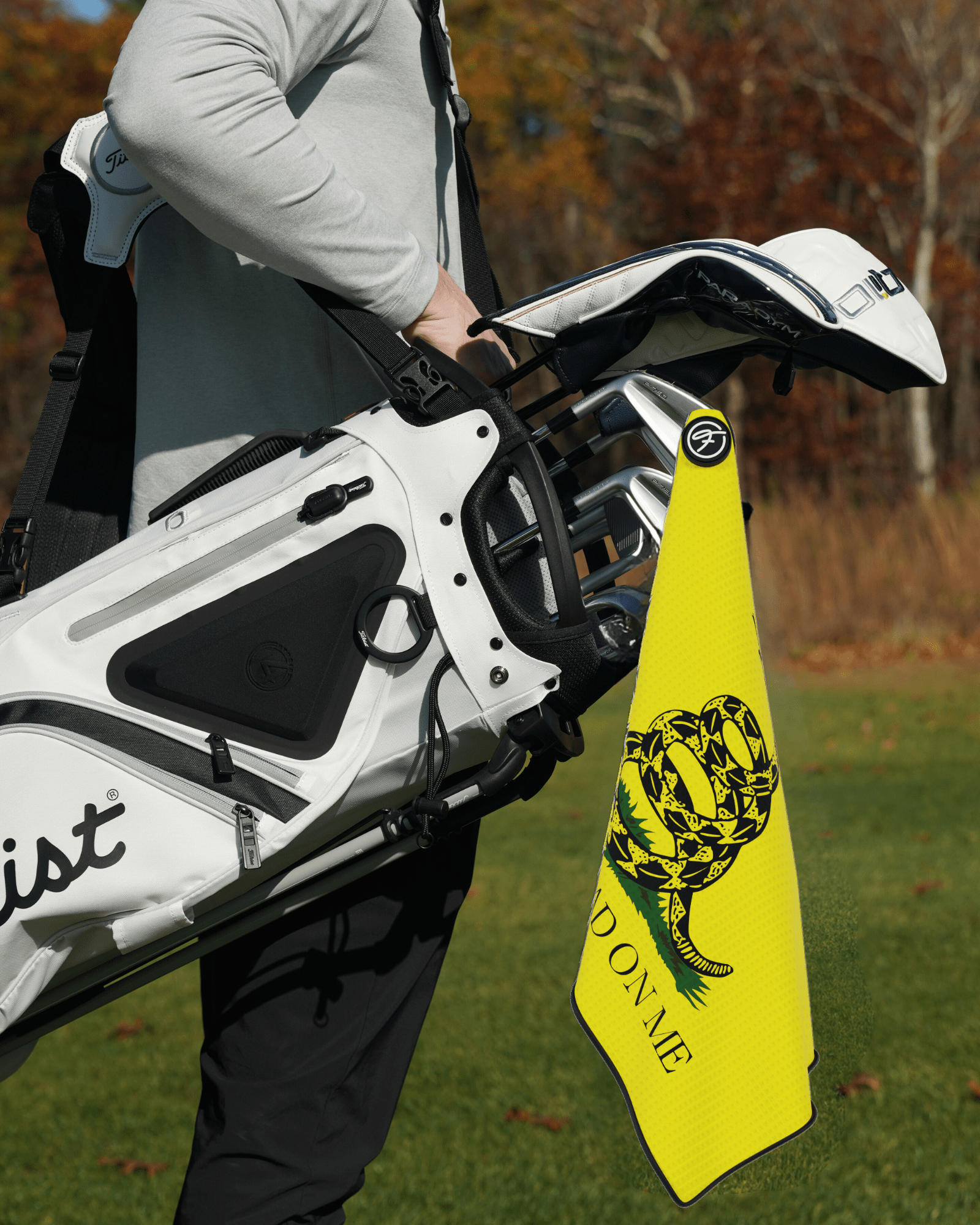 Flag Magnetic Golf Towel with Don’t Tread On Me Magnetic Golf Towel design attached to a golf bag. #color_dont-tread-on-me