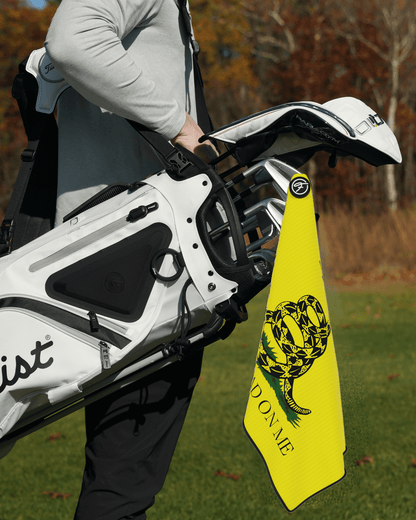 Flag Magnetic Golf Towel with Don’t Tread On Me Magnetic Golf Towel design attached to a golf bag. #color_dont-tread-on-me