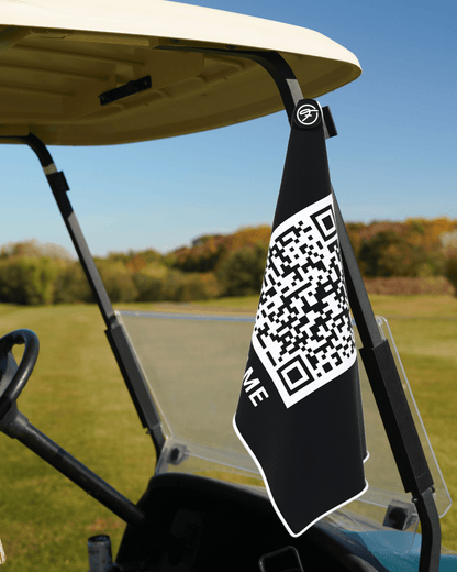 Funny Magnetic Golf Towel with Scan Me design securely attached to a golf cart. #color_scan-me